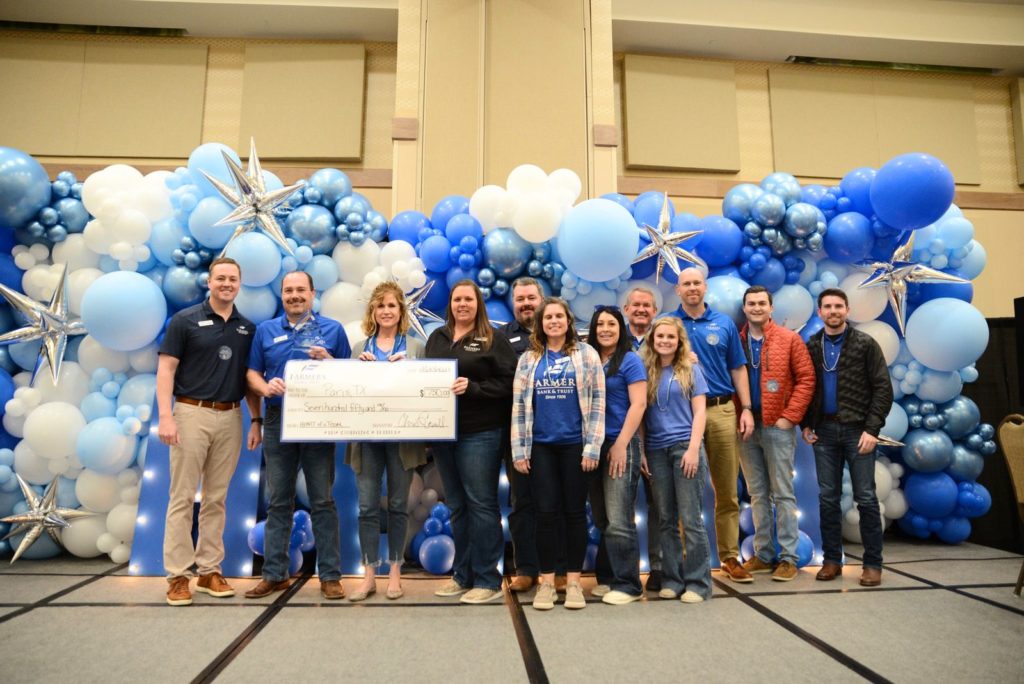Paris, Texas branch team members posing with their award alongside CEO Chris Gosnell.